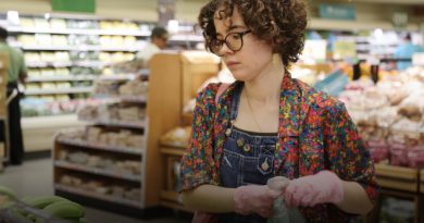 Isabella Garcia picking groceries as part of the Buddy System.