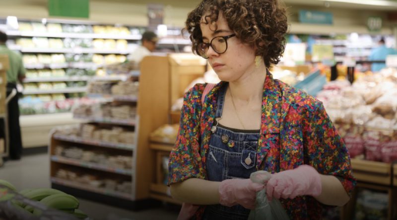 Isabella Garcia picking groceries as part of the Buddy System.
