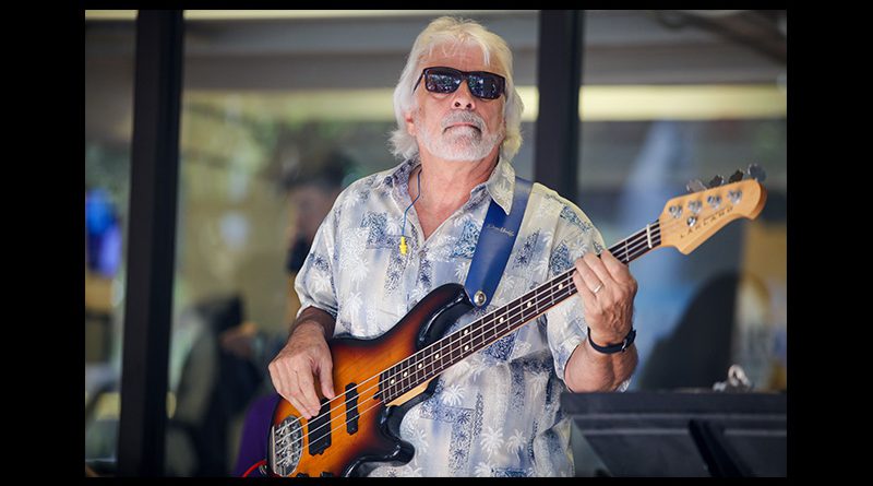 Matthew Bonelli playing bass guitar.