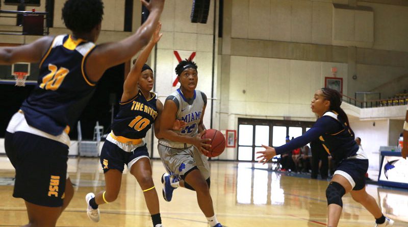 Daliyah Brown trying to make a basket.