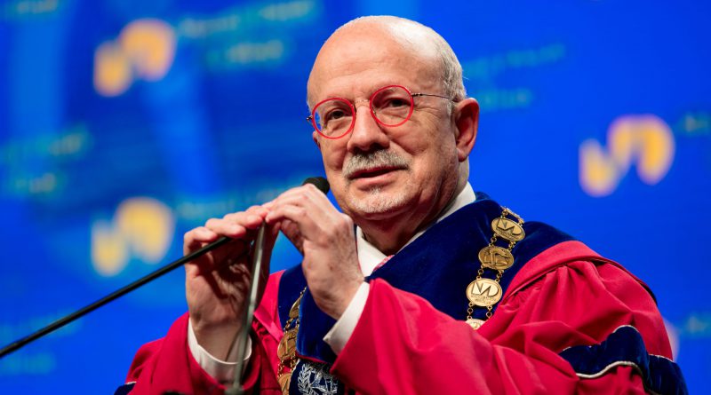 Dr. Padron giving a speech on stage.