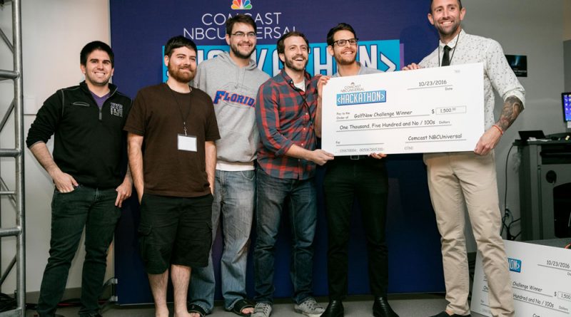 Winners of Hackathon holding their award.