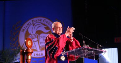 Padron clapping for the student body.