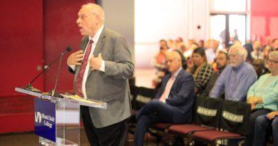 Mark Richard giving a speech to the Board of Trustees.